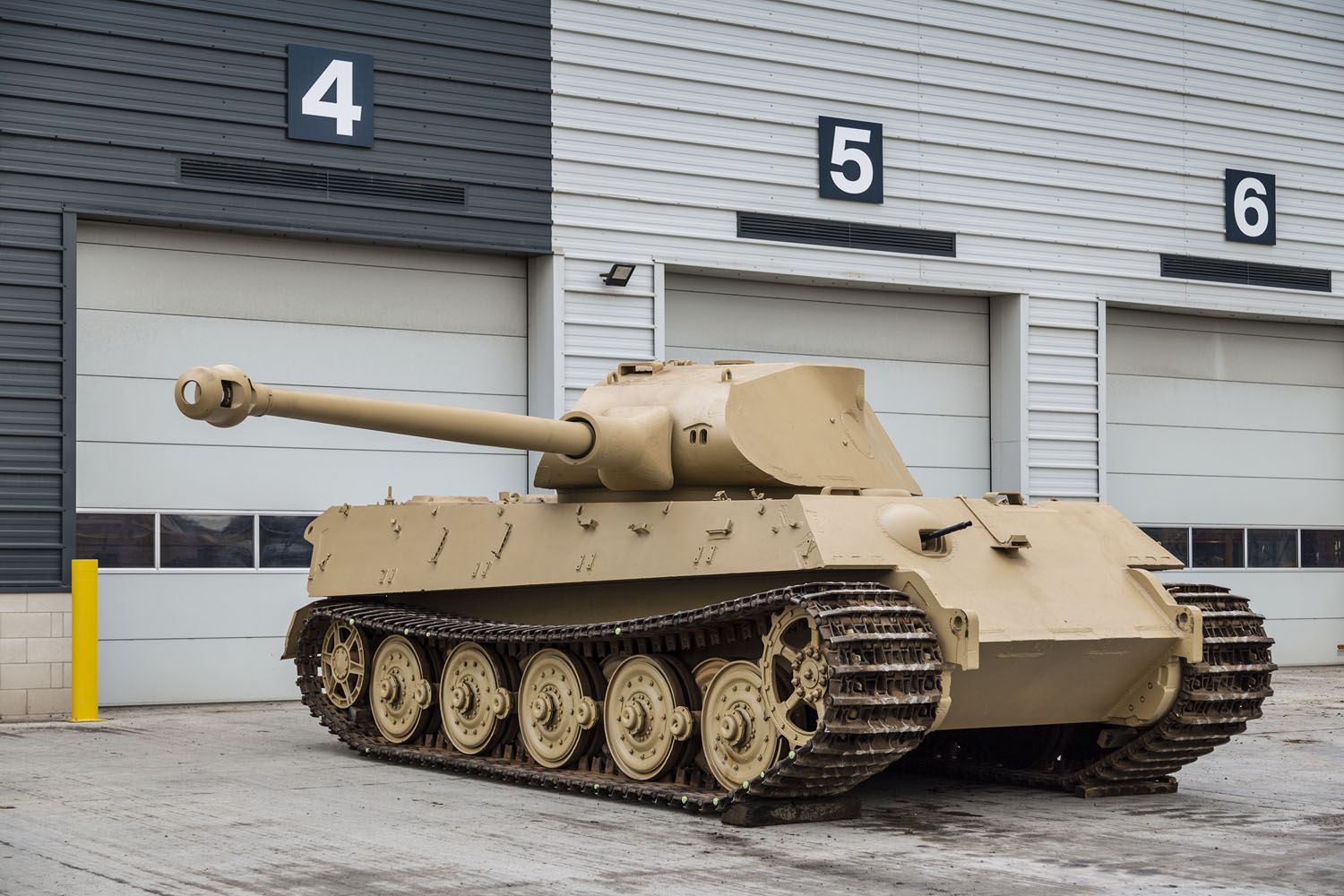 King Tiger V2 King Tiger V2 posing in front of the workshop