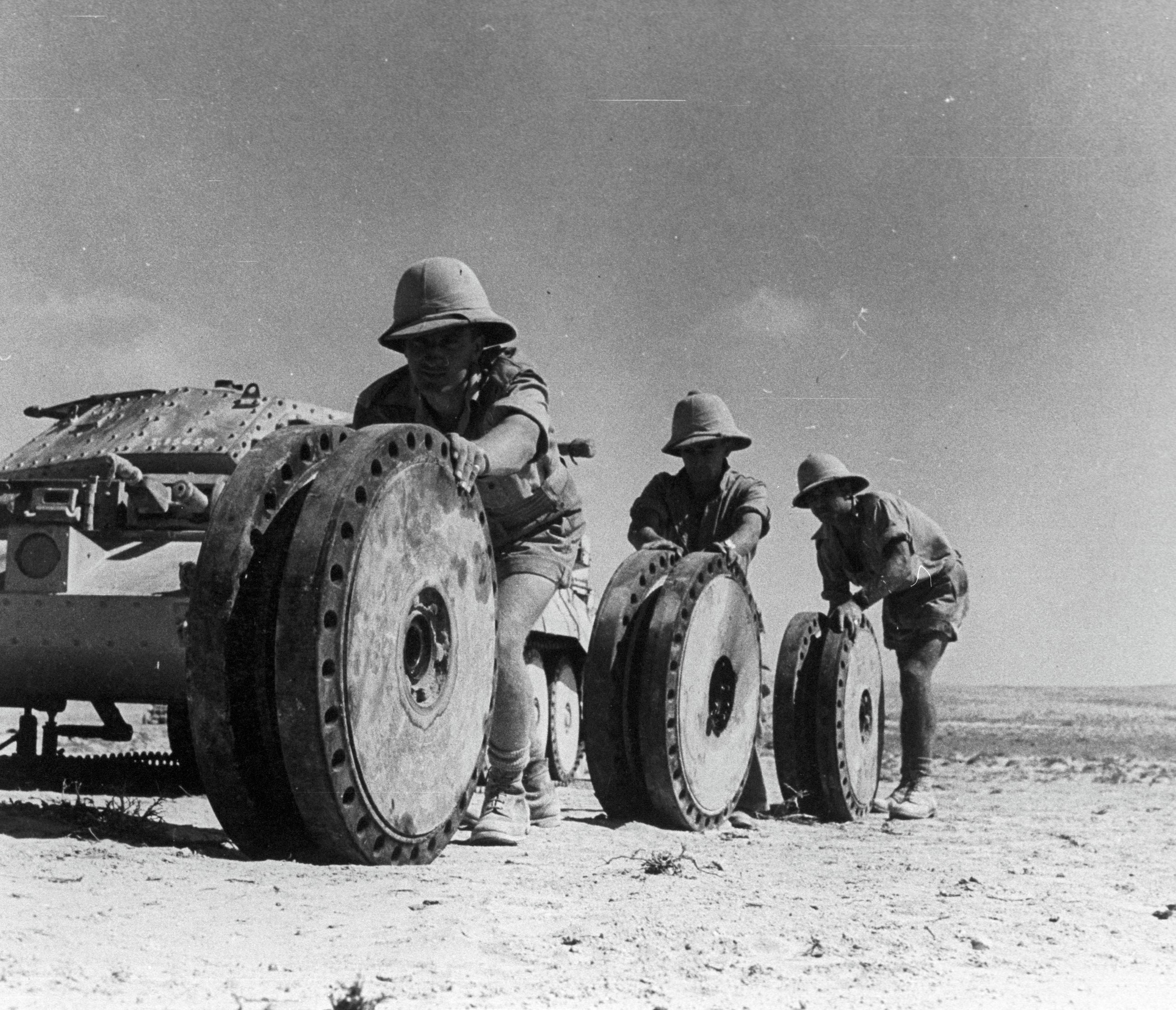 Crusader crewmen move three of its 32 inch diameter road wheels Crusader crewmen move three of its 32 inch diameter road wheels