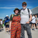 Couple at TANKFEST with people in the background