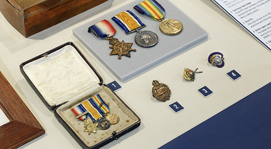 Harold Mortimore's personal items, including his British Legion Lapel Badge.